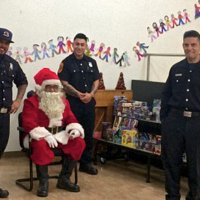 12/18/18 - Los Bomberos Firefighters with Santa at Mission Education Center - Santa and crew ready for the students to arrive.