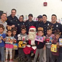 12/18/18 - Los Bomberos Firefighters with Santa at Mission Education Center - Santa, and crew, with the second grade class.