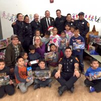 12/18/18 - Los Bomberos Firefighters with Santa at Mission Education Center - Santa, with teachers and crew, with the fourth grade class.