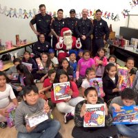 12/18/18 - Los Bomberos Firefighters with Santa at Mission Education Center - Santa, and crew, with the fifth grade class.