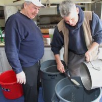 2/24/18 - 33rd Annual Crab Feed - Lions Bob Fenech and Steve Martin pouring marinade on the crab.