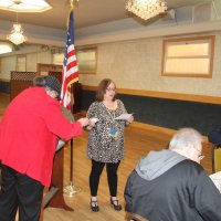 4/18/18 - 2018 Y & C Drawing, IASC - Lions Sharon Eberhardt handing Viela du Pont another winning ticket stub. Lions Lyle Workman, not paying attention, and Joe Farrah.
