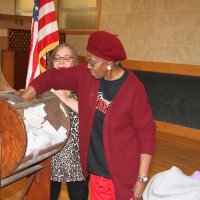 4/18/18 - 2018 Y & C Drawing, IASC - Guest Mildred Hamilton, with Eastern Star, Rho Chapter, drawing another winner as Lion Viela du Pont, raffle chair, looks on.