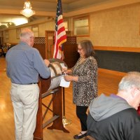 4/18/18 - 2018 Y & C Drawing, IASC - Lion Bill Graziano waits as Lion Viela du Pont prepares the drum of tickets for the next winner to be drawn. Lions Lyle Workman and Sharon Eberhardt (seated) waiting to tabulate the winner of the draw.