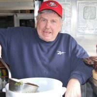 2/23/19 - 34th Annual Crab Feed - Lion Bob Fenech, chairman, stirring the crab marinade before pouring over the crab.