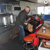 2/23/19 - 34th Annual Crab Feed - Lions Steve Martin and Bob Fenech (chairman) mixing, and distributing the marinade, by pouring from one container to another.