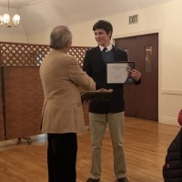 1/15/20 - Student Speaker Contest at the I.A.S.C - Topic: Homelessness in California: What is the Solution? - Lion Chairman Paul Corvi presenting winner’s check and certificate to Michael Gray. Lion Bob Fenech on the right.