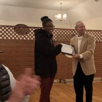 1/15/20 - Student Speaker Contest at the I.A.S.C - Topic: Homelessness in California: What is the Solution? - Student speaker Xiomara Larkin proudly posing with Lion Chairman Paul Corvi while accepting her first runner up certificate. Guest judge John Paul on left.