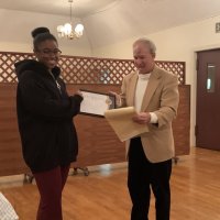 1/15/20 - Student Speaker Contest at the I.A.S.C - Topic: Homelessness in California: What is the Solution? - Student speaker Xiomara Larkin proudly posing with Lion Chairman Paul Corvi while accepting her first runner up certificate.