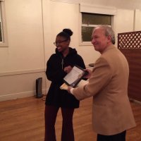 1/15/20 - Student Speaker Contest at the I.A.S.C - Topic: Homelessness in California: What is the Solution? - Student speaker Xiomara Larkin proudly posing with Lion Chairman Paul Corvi while accepting her first runner up certificate.
