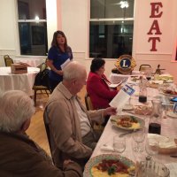 11-17-21 - San Francisco Unified Lions Club Visitation, IASC, San Francisco - L to R, seated: Joe Farrah, Ward Donnelly, and Zenaida Lawhon; Lion President Carol Fung (standing) talking about S. F. Unified’s  activities.