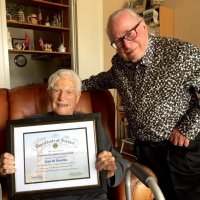 8/19/21 - Al Gentile’s Home, San Mateo - Lion Al Gentile proudly holds his Certificate of Service for 64 years of service while posing with Lion Bob Lawhon.