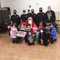 12-10-21 - Mission Education Center Christmas with Santa @ MEC, San Francisco - Children pose with Santa and Los Bomberos Firefighters, their teachers, and Steve Martin (last standing on right) after receiving their gifts.