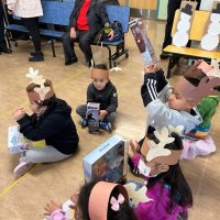 12-9-22 - Mission Education Center Christmas with Santa, San Francisco - Students can hardly wait to play with their new gifts.