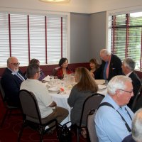 7-19-23 - Basque Cultural Center, South San Francisco - 74th Installation of Officers - The President’s table: two guests (backs to camera), far left: Clayton Jolley, 1st VDG, Sharon Eberhardt, Zenaida Lawhon, Rose Benavente, Bob Lawhon (standing), and Mario Benavente. Forground: three of Steve Martin’s guests.
