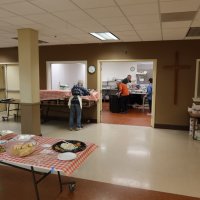 2-25-23 - 36th Annual Crab Feed - St. Philip the Apostle Church, San Francisco - Some of the kitchen crew at work; outside kitchen: Rose Ann Harris; in kitchen, L to R: Paul Corvi, Steve Martin, and Leona Wong.