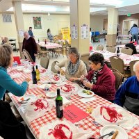 2-25-23 - 36th Annual Crab Feed - St. Philip the Apostle Church, San Francisco - Joe Farrah, on right, with some of his guests; Bob Lawhon, right center, with maroon sweater; Tom & Kathy Toohey, down from Sonoma, are seated far left.