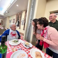 2-25-23 - 36th Annual Crab Feed - St. Philip the Apostle Church, San Francisco - Joe Farrah, seated, with some of his fans.