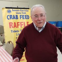 2-25-23 - 36th Annual Crab Feed - St. Philip the Apostle Church, San Francisco - Bob Lawhon, taking time to pose in the madness. George Salet on the right.