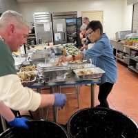 2-25-23 - 36th Annual Crab Feed - St. Philip the Apostle Church, San Francisco - Getting the crab into the serving trays are Steve Martin, left, with, front to back: Leona Wong, Rose Ann Harris, and Bob Fenech.