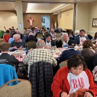 2-25-23 - 36th Annual Crab Feed - St. Philip the Apostle Church, San Francisco - Guests busily eating up their crab; Zenaida Lawhon, in the foreground. Also in the photo are George Salet, Joe & Francisca Workman, Linda Workman, Sharon Eberhardt, and Rose Ann Harris.