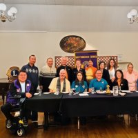 11-19-25 - Photo by Gregory Leung - SFCCLC meting hosted by the Geneva-Excelsior Lions, Italian American Social Club, San Francisco - Most of the visiting Lions striking a pose. Lion President Stephen Martin in the yellow shirt with scarf.