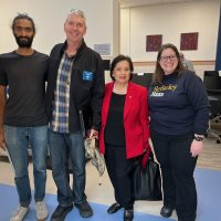 7-16-25 - Clinic by the Bay, San Francisco - Photo from Bob Lawhon - Three Lions made a quick visit to the Clinic by the Bay before our regular meeting. L to R: staff, Stephen Martin, Zenaida Lawhon, and staff.